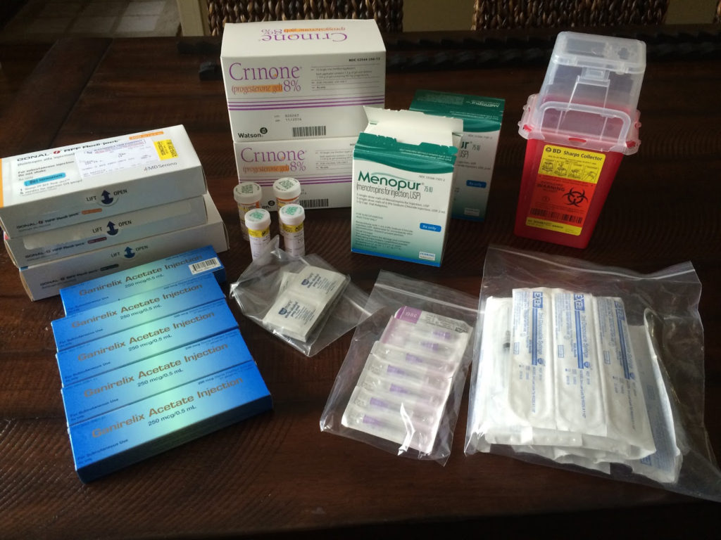 The Abbreviation IVF Is Laid Out In Wooden Letters On A Blue Background. In  Vitro Injection Pen, Tablet And Ampoule. A Syringe With A Thin Huge. IVF  Concept. Medication With Hormones. Infertility